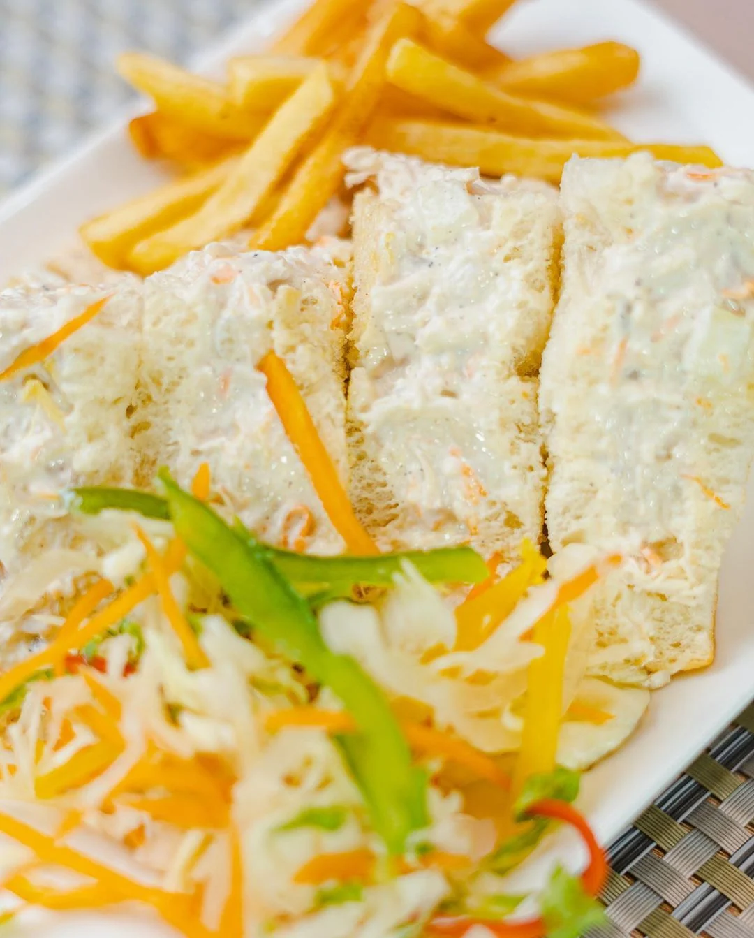 A club sandwich with fries