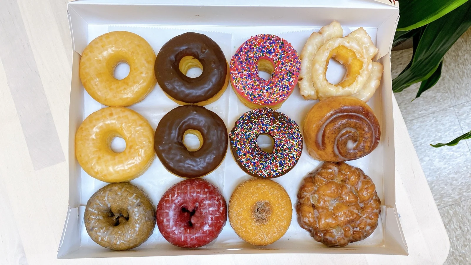 A selection of iced, glazed and sprinkled doughnuts