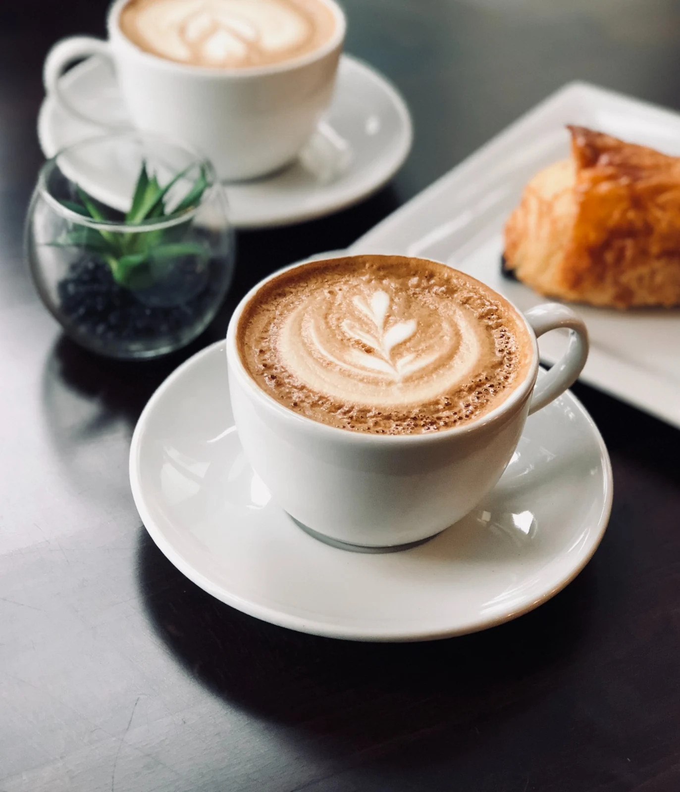 Cups of coffee with latte art